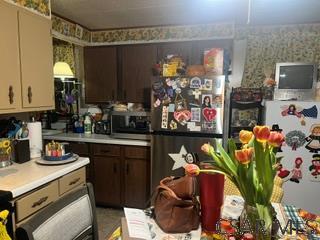 807 17th Street Windber, PA 15963 - Photo 2 of 8 a kitchen with stainless steel appliances kitchen island granite countertop a sink a stove and a microwave