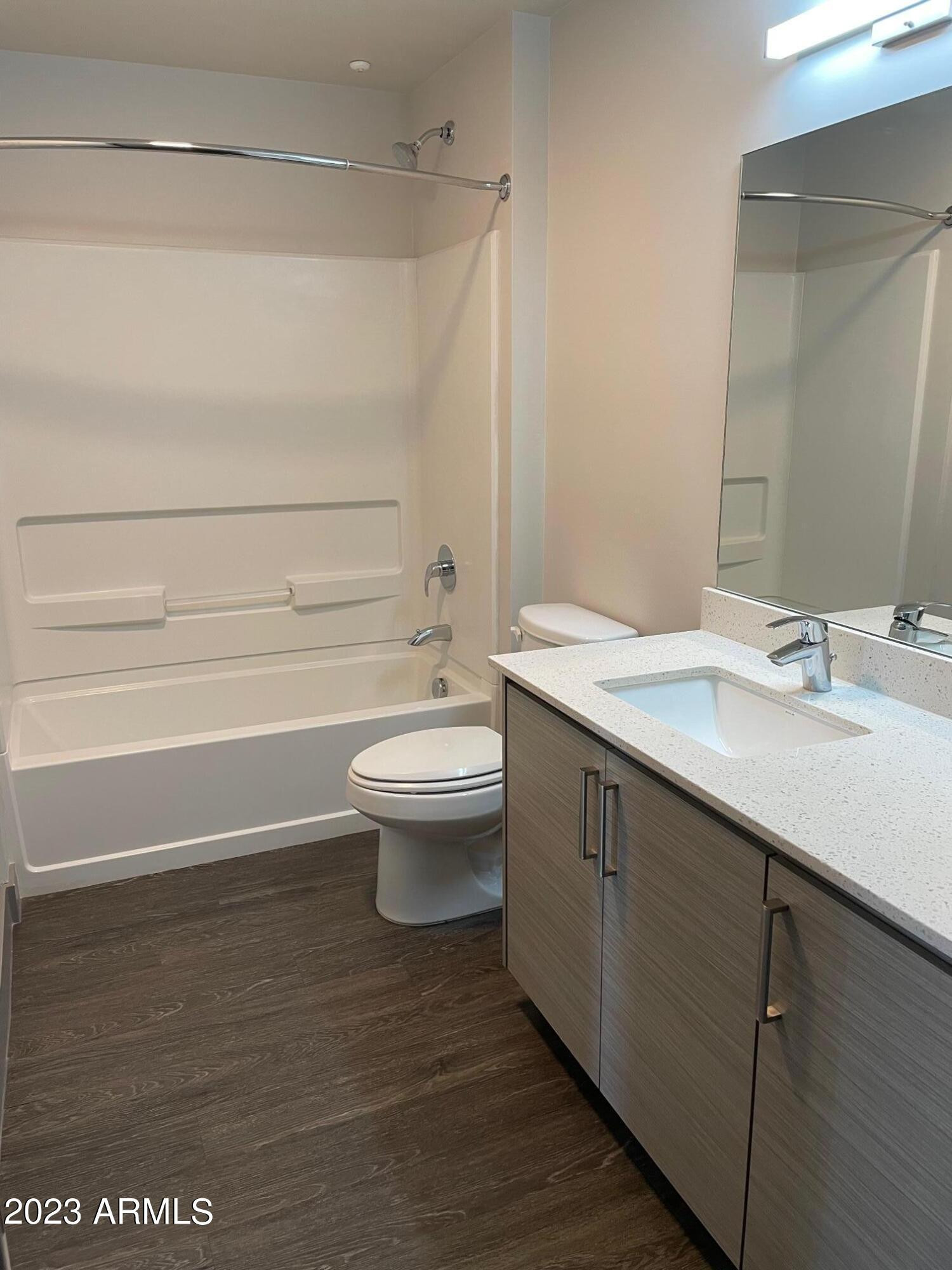 425 West Osborn Road, Unit 210 Phoenix, AZ 85013 - Photo 13 of 31 a bathroom with a sink a toilet and shower