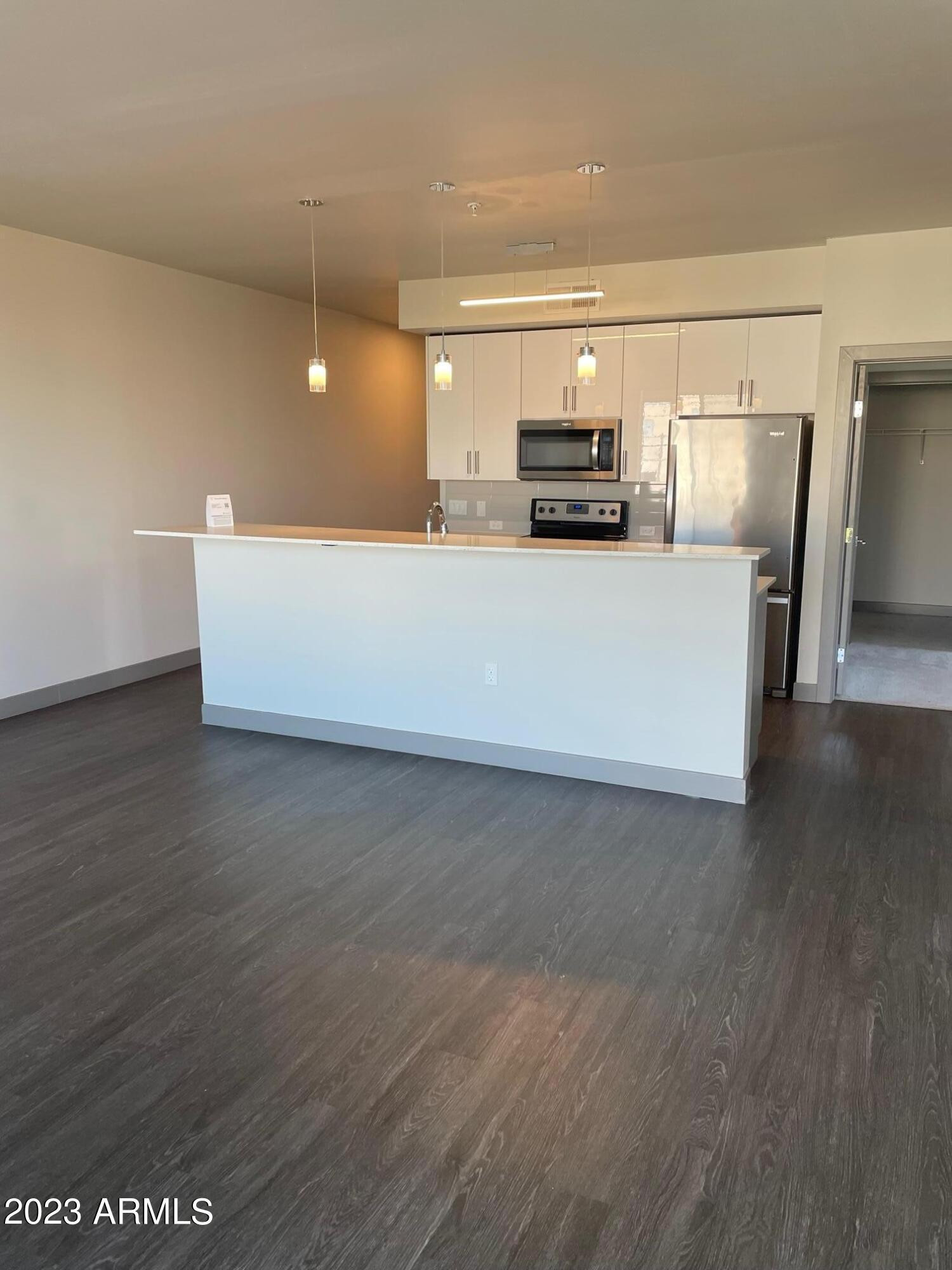 425 West Osborn Road, Unit 210 Phoenix, AZ 85013 - Photo 7 of 31 a view of kitchen with stainless steel appliances wooden floor