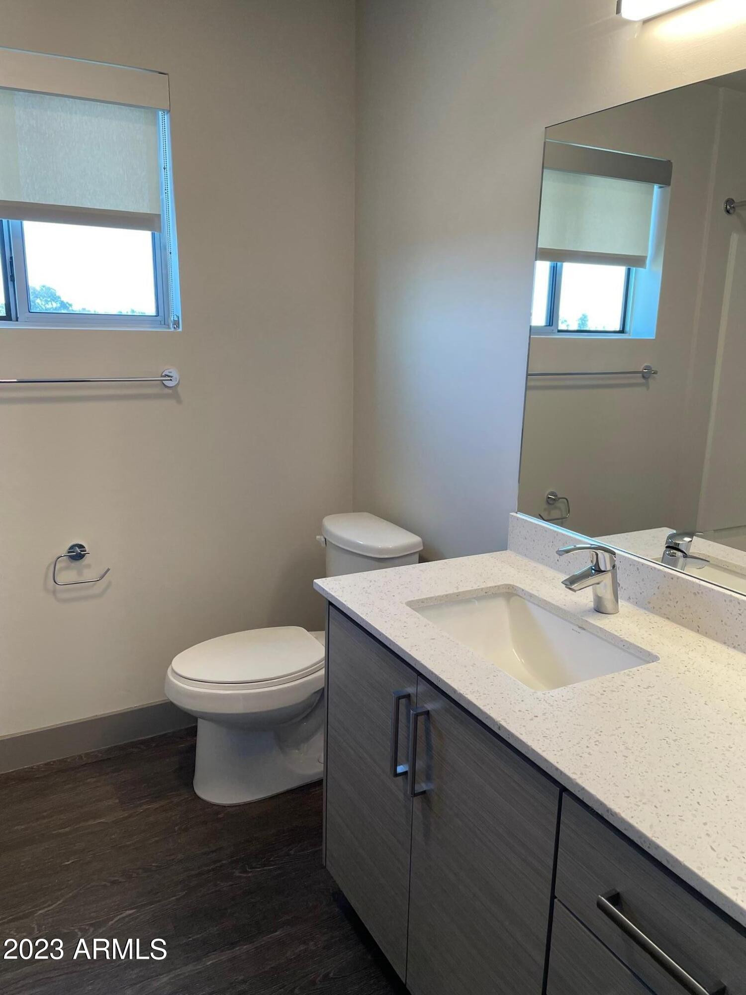 425 West Osborn Road, Unit 210 Phoenix, AZ 85013 - Photo 8 of 31 a bathroom with a sink a toilet and mirror