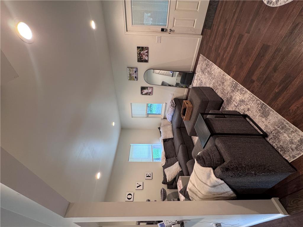130 Hidden Spur Road Lehighton, PA 18235 - Photo 6 of 19 Natural light illuminates rich hardwood floors, creating an inviting space for relaxation.