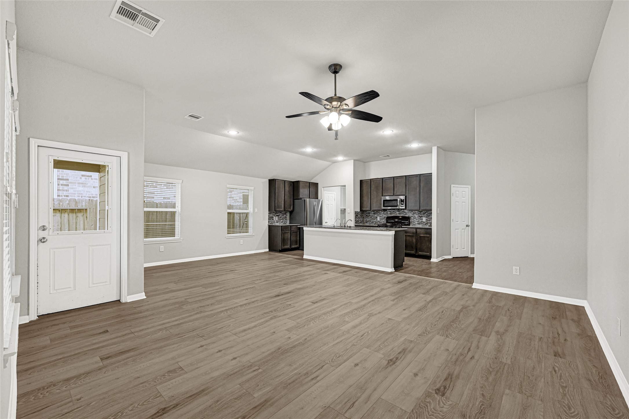2249 Yellow Fern Path Spring, TX 77386 - Photo 13 of 49 a view of kitchen with cabinets stainless steel appliances and wooden floor
