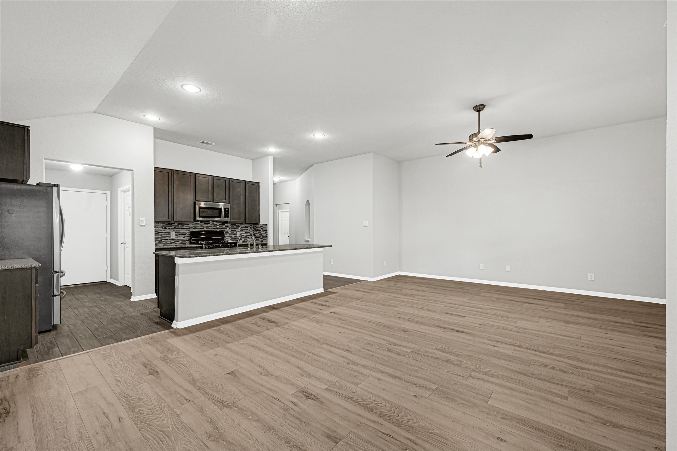 2249 Yellow Fern Path Spring, TX 77386 - Photo 14 of 49 a view of kitchen with refrigerator microwave and stove