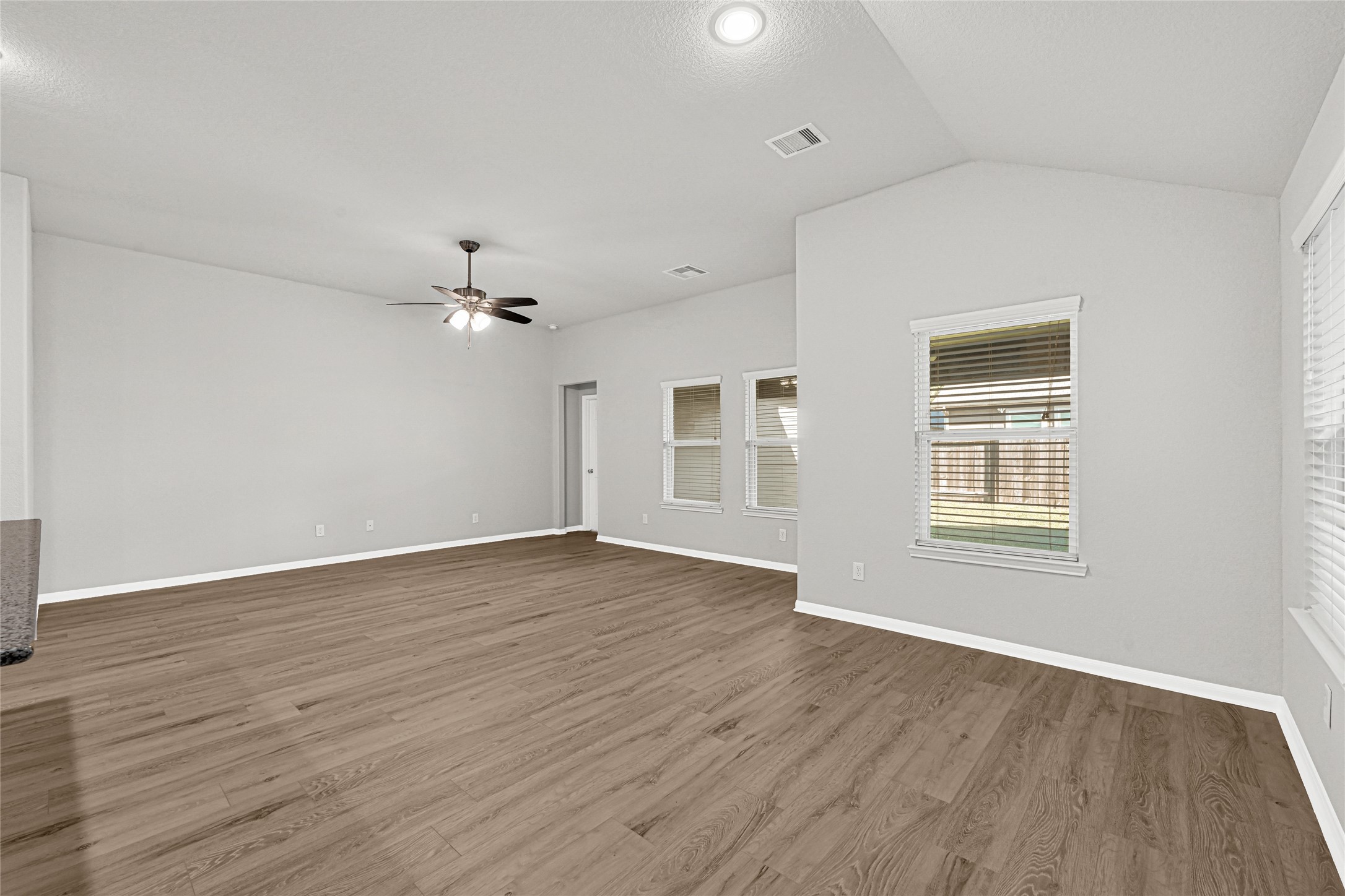 2249 Yellow Fern Path Spring, TX 77386 - Photo 21 of 49 a view of an empty room with wooden floor and a window