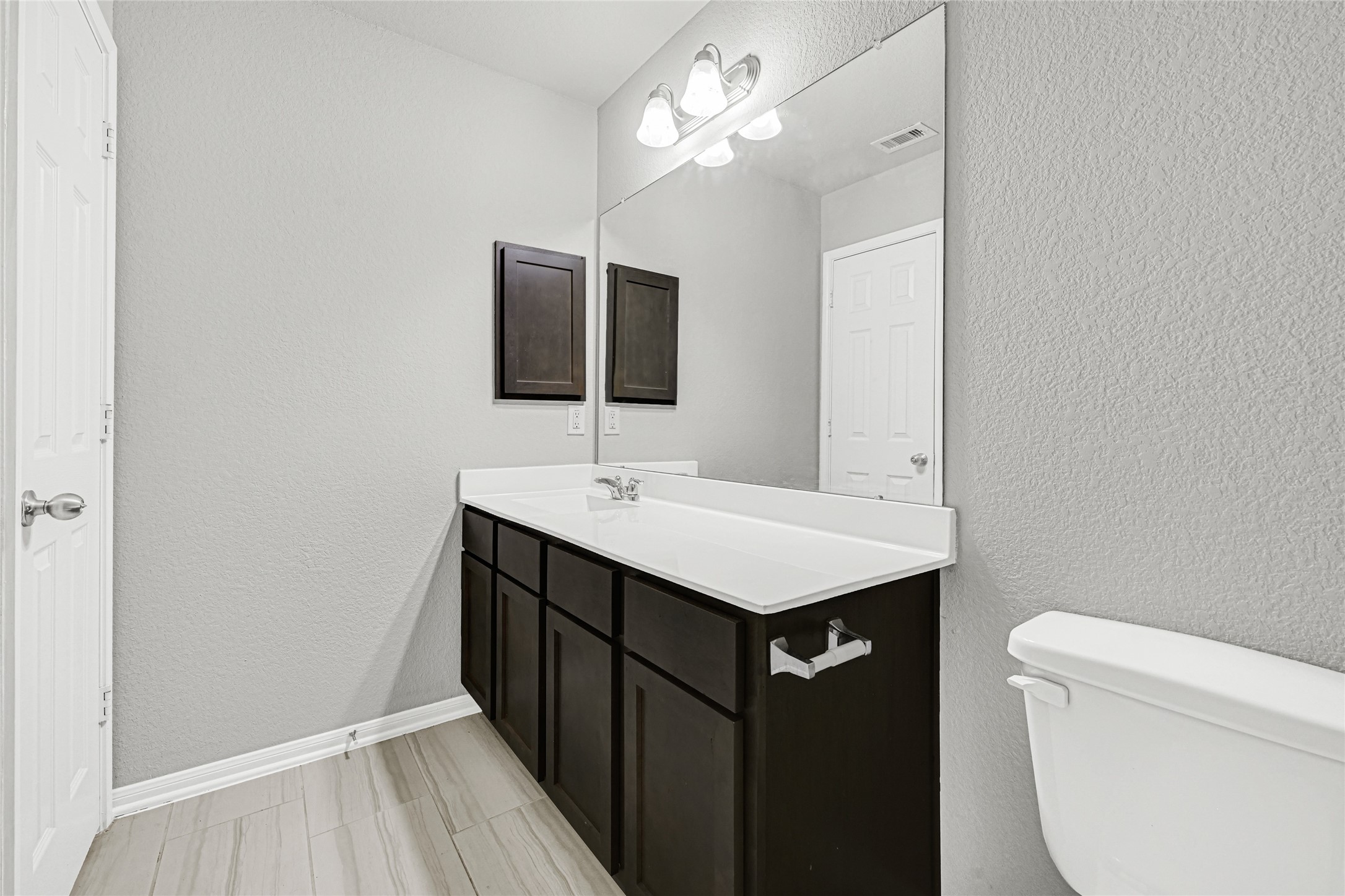 2249 Yellow Fern Path Spring, TX 77386 - Photo 27 of 49 a bathroom with a sink toilet and mirror