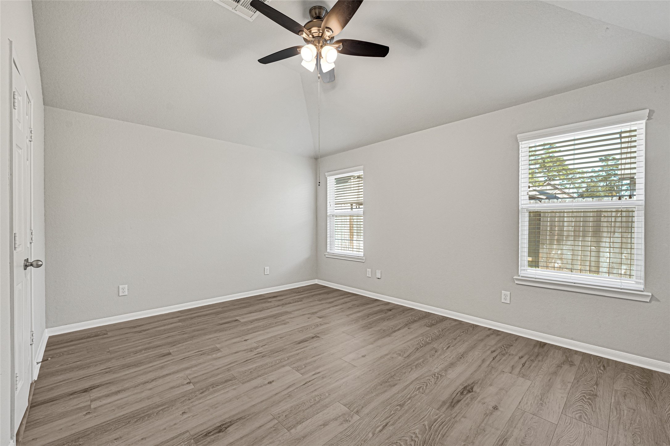 2249 Yellow Fern Path Spring, TX 77386 - Photo 31 of 49 wooden floor in an empty room with a window