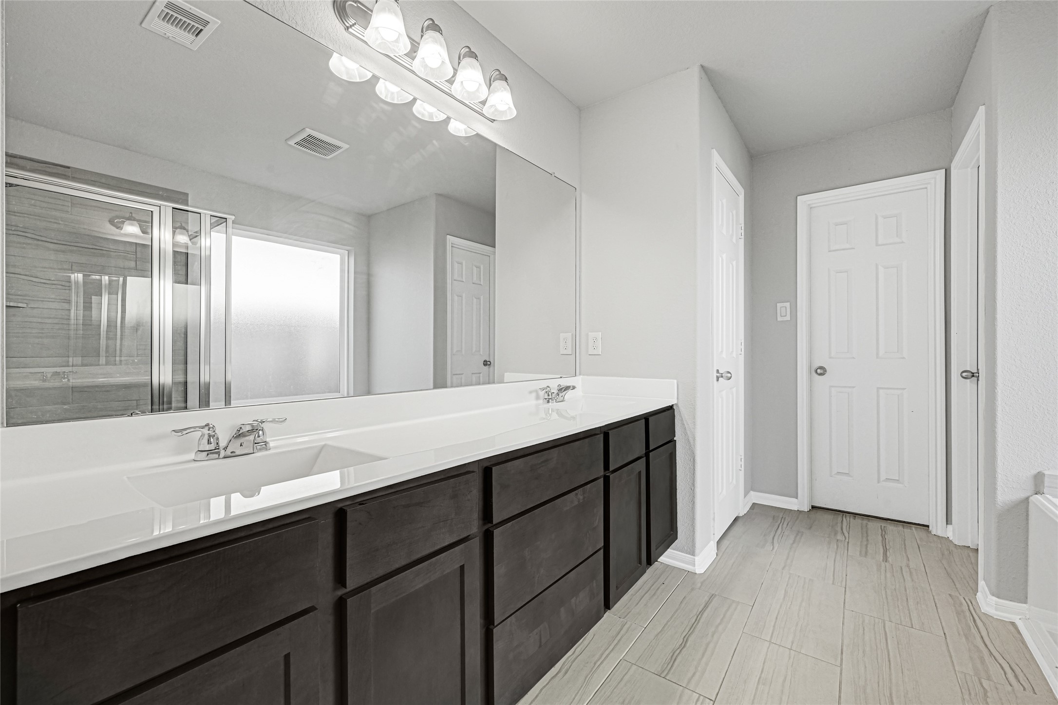 2249 Yellow Fern Path Spring, TX 77386 - Photo 34 of 49 a bathroom with a double vanity sink and a mirror