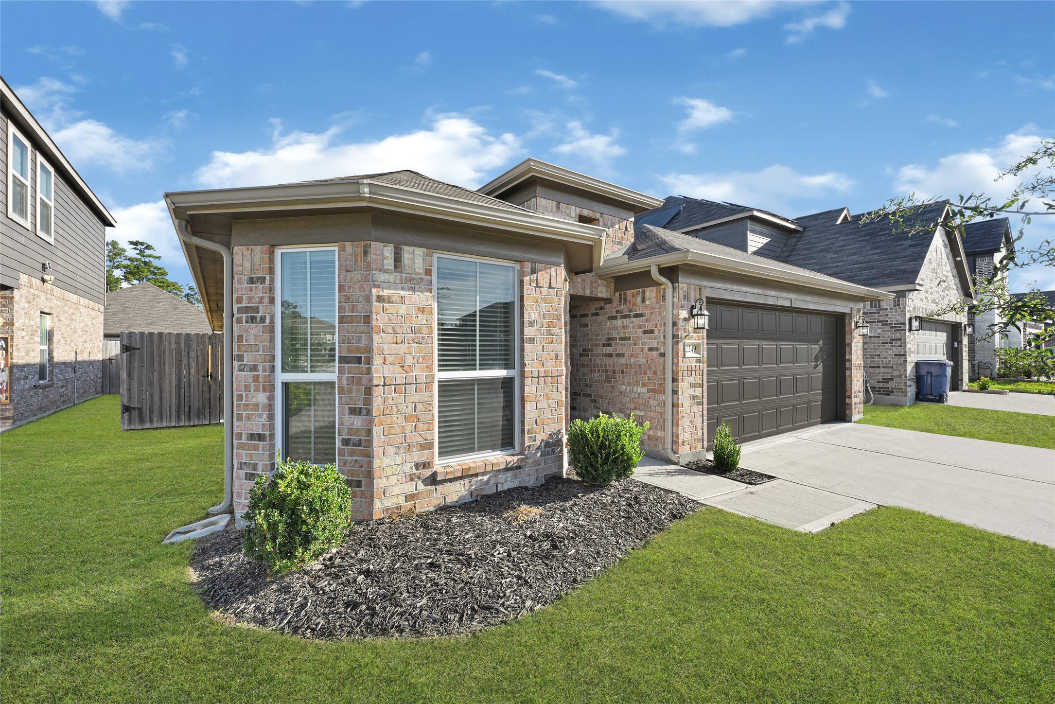 2249 Yellow Fern Path Spring, TX 77386 - Photo 46 of 49 a front view of a house with garden