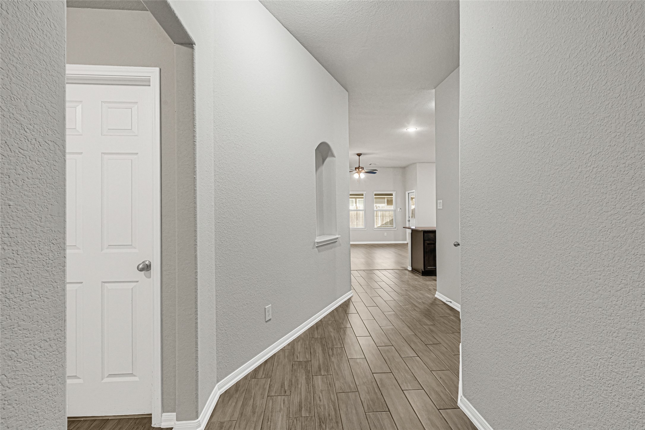 2249 Yellow Fern Path Spring, TX 77386 - Photo 9 of 49 a view of a hallway with wooden floor windows and a living room