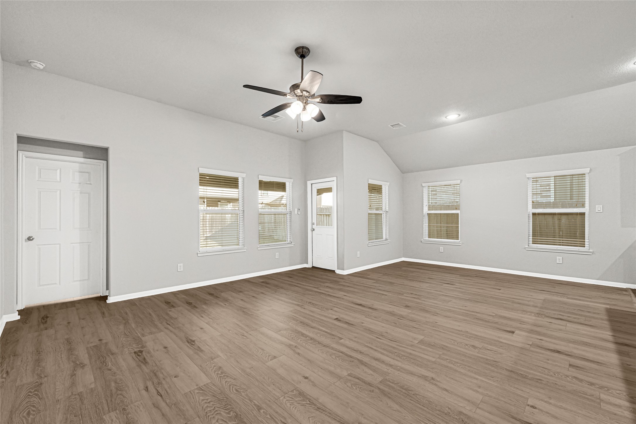 2249 Yellow Fern Path Spring, TX 77386 - Photo 10 of 49 a view of an empty room with window and wooden floor