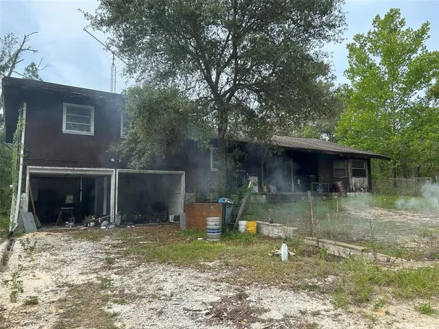 a backyard of a house with seating space