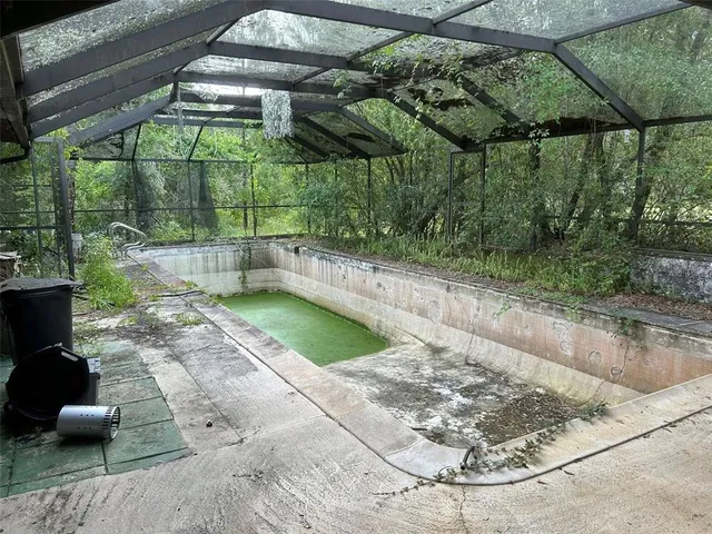 a view of a backyard with sitting area
