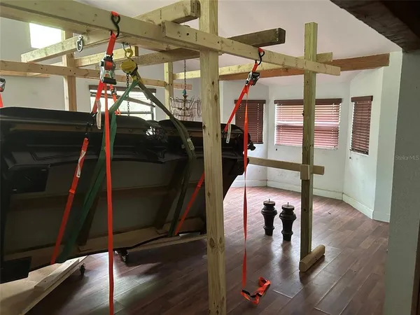 a view of a gallery with wooden floor