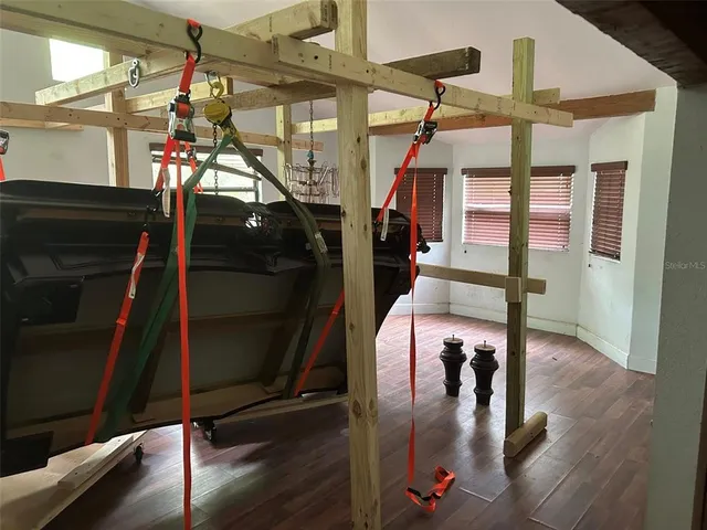 a view of a gallery with wooden floor