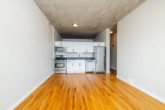 a view of kitchen with wooden floor