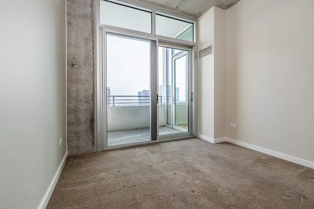 a view of an empty room and window