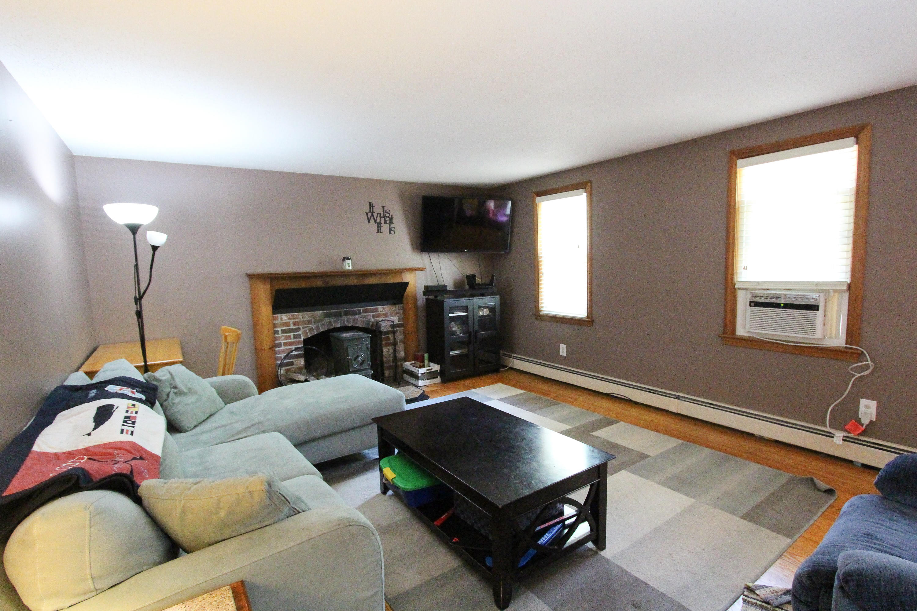 25 Bridgets Path Centerville, MA 02632 - Photo 14 of 23 a living room with furniture and a fireplace