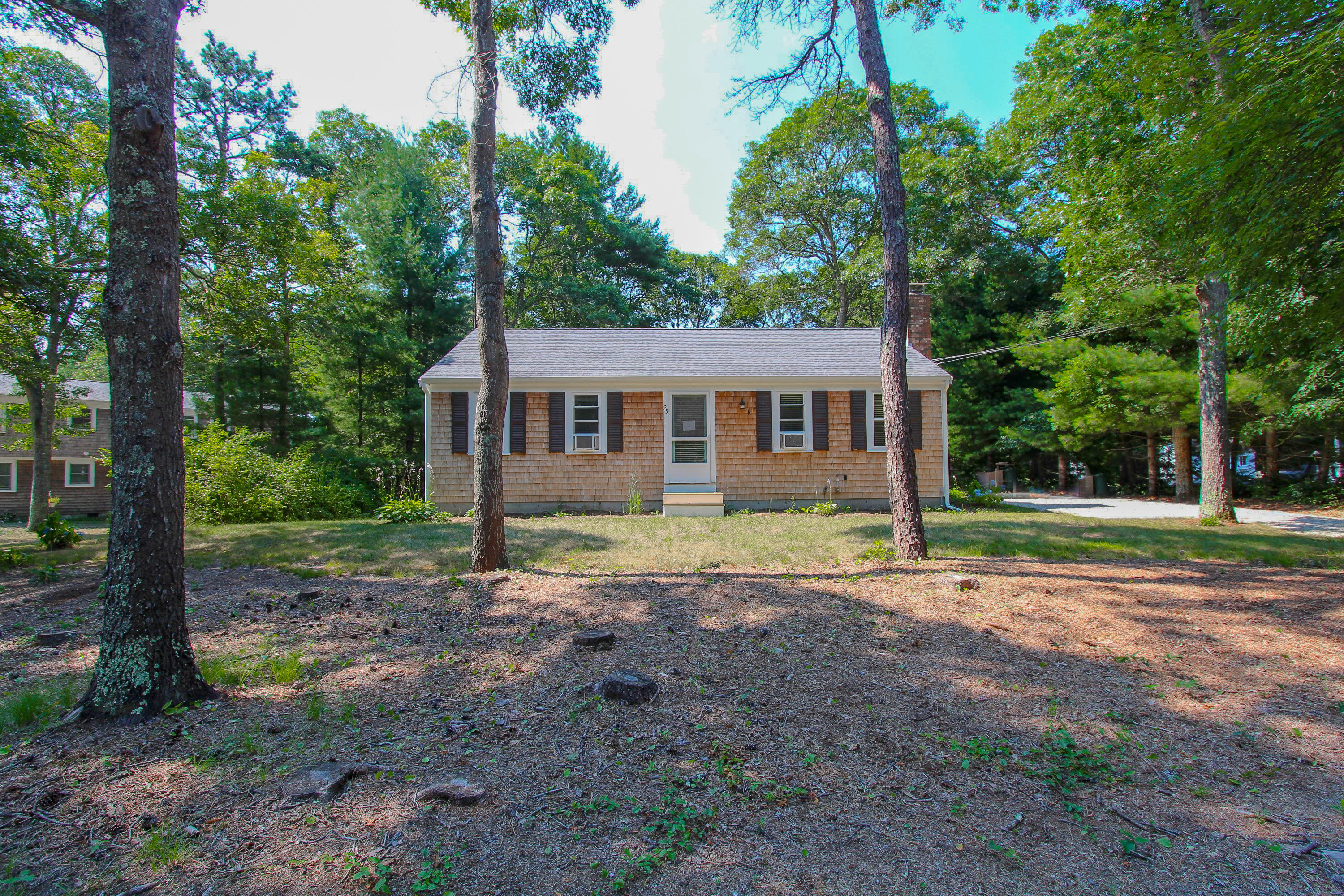 25 Bridgets Path Centerville, MA 02632 - Photo 20 of 23 a view of a house with a yard