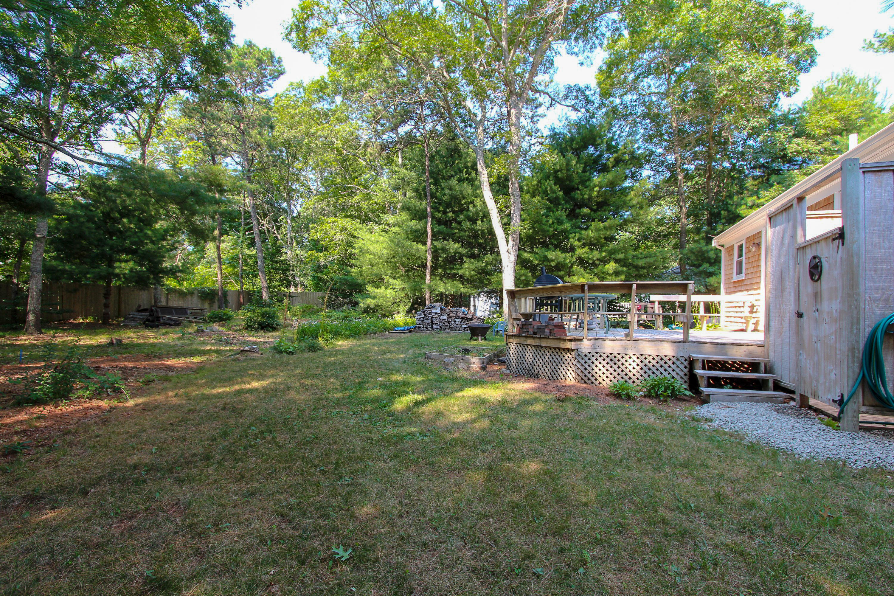 25 Bridgets Path Centerville, MA 02632 - Photo 2 of 23 a view of backyard with swimming pool