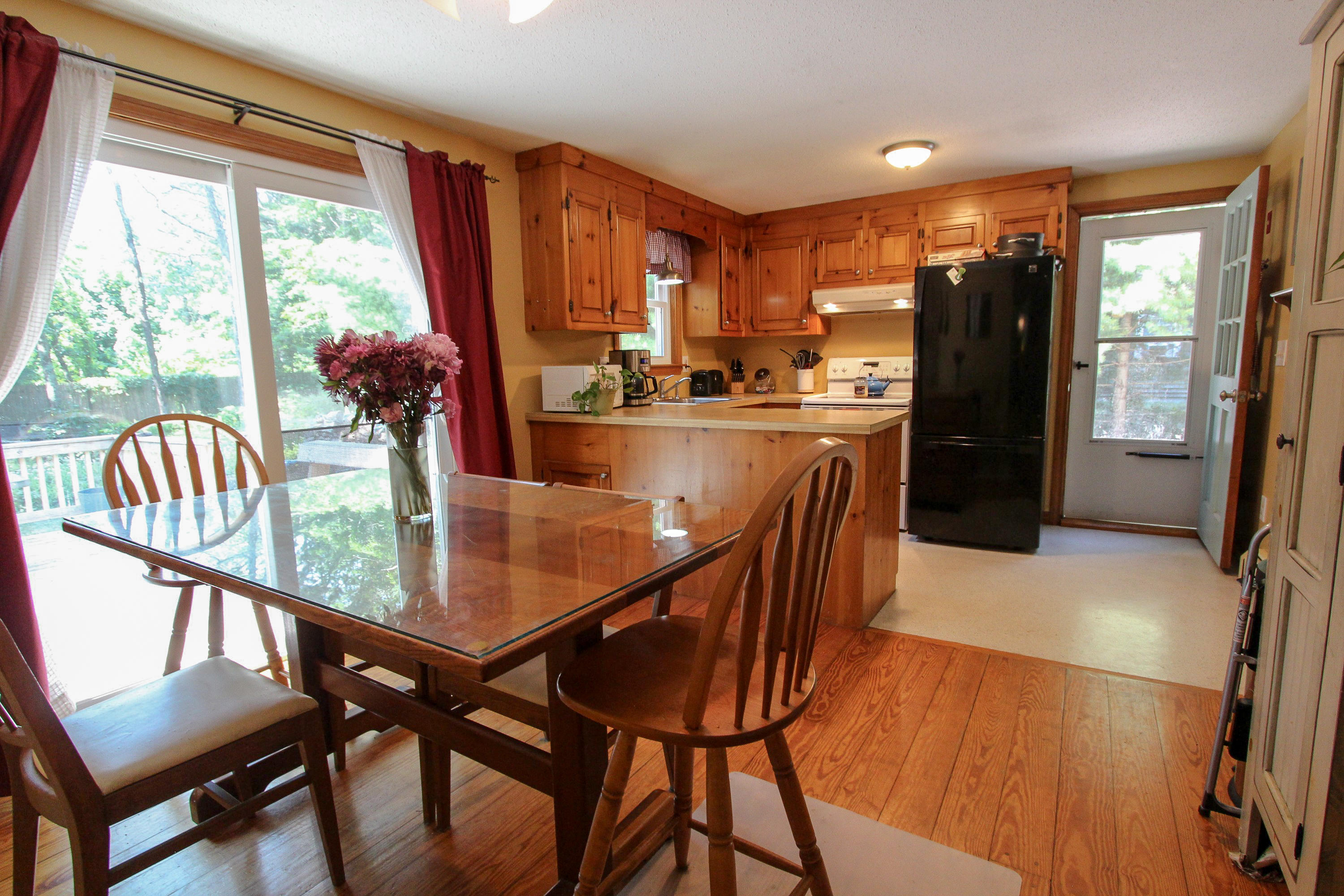 25 Bridgets Path Centerville, MA 02632 - Photo 4 of 23 a view of a dining room with furniture window and outside view