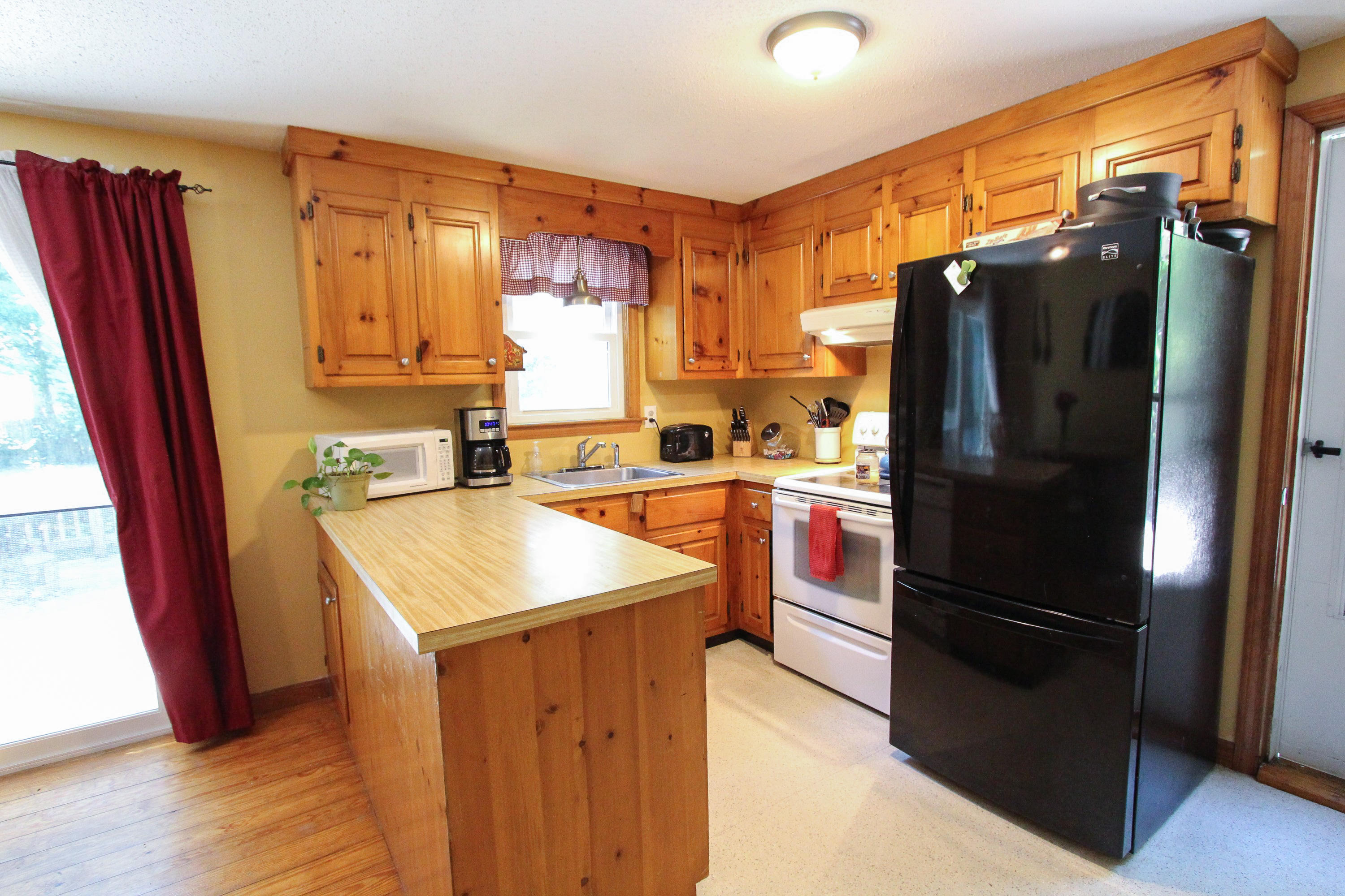 25 Bridgets Path Centerville, MA 02632 - Photo 7 of 23 a kitchen with stainless steel appliances granite countertop a refrigerator a sink and a stove