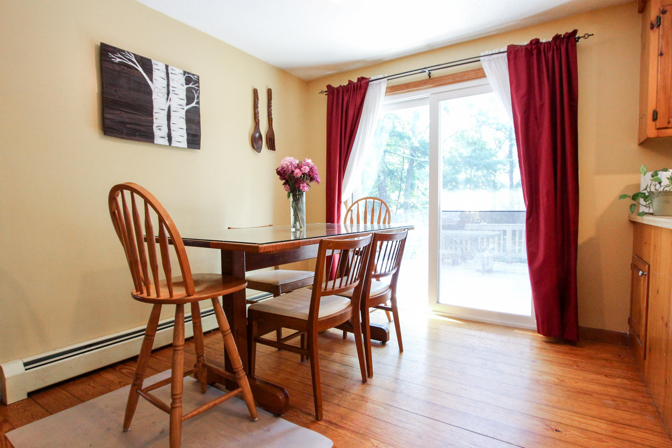 25 Bridgets Path Centerville, MA 02632 - Photo 9 of 23 a view of a dining room with furniture window and wooden floor