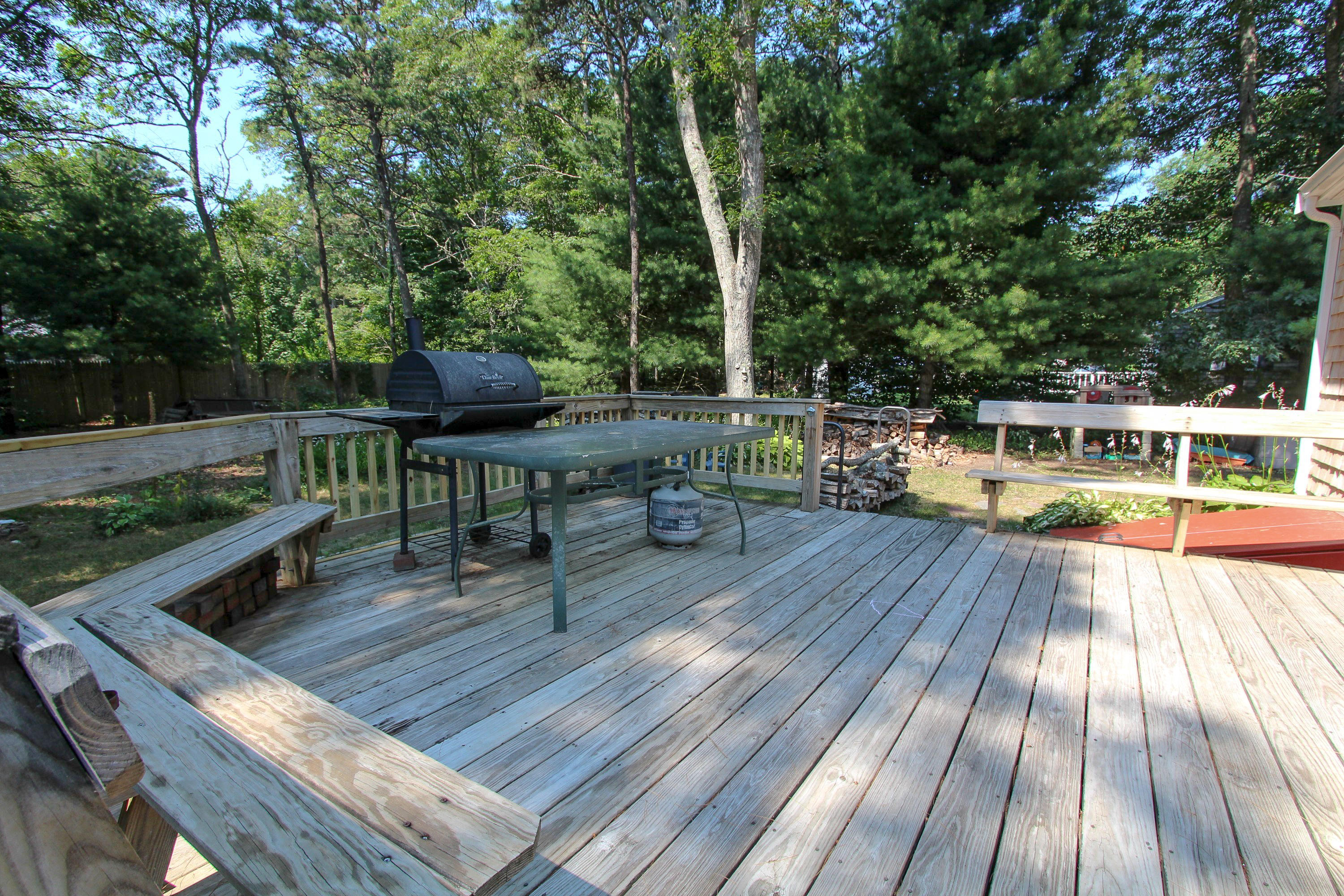 25 Bridgets Path Centerville, MA 02632 - Photo 10 of 23 a view of backyard with deck and outdoor seating
