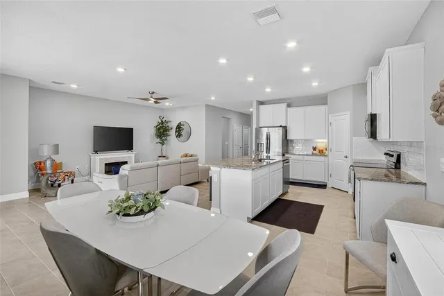 a dining room with furniture and window