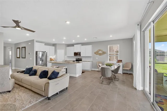 a bedroom with a bed window and couch