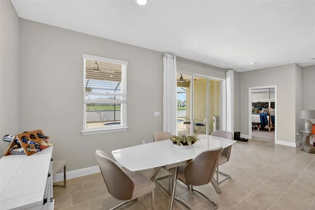 a bathroom with a granite countertop toilet and a sink