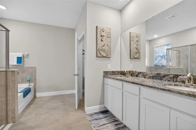 a bed sitting in a balcony next to a yard