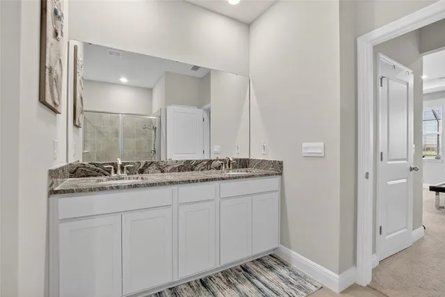 a view of a lake with houses in the back