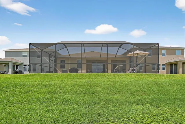 a bathroom with a toilet and a shower curtain
