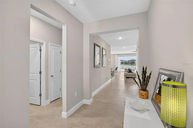 a kitchen with sink refrigerator and microwave