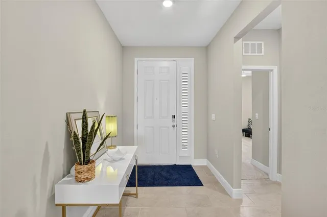 a kitchen with stainless steel appliances granite countertop a sink stove microwave and refrigerator