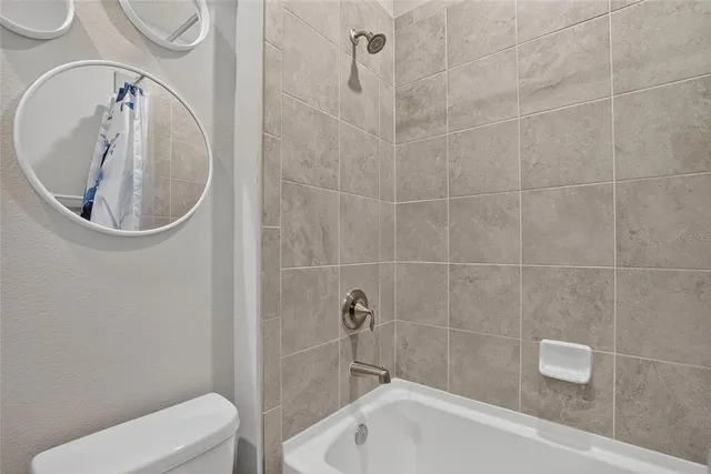 an aerial view of multiple houses with yard