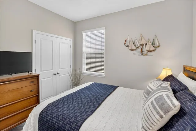 an aerial view of a house with a yard and lake view