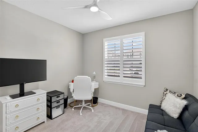 an aerial view of residential houses with outdoor space and ocean view