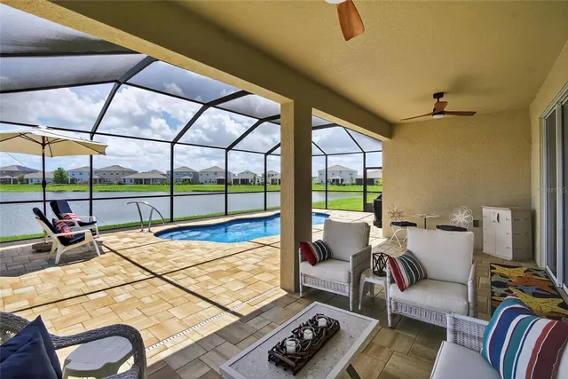 a kitchen with white cabinets sink and stainless steel appliances