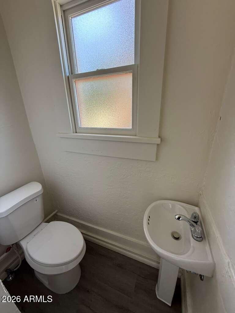 647 East 8th Street Douglas, AZ 85607 - Photo 11 of 11 a bathroom with a sink toilet and mirror