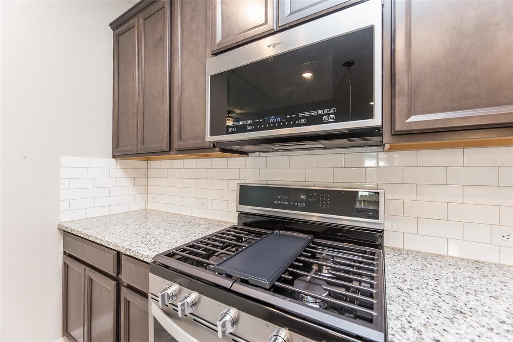 1230 Glendora Drive Rosharon, TX 77583 - Photo 11 of 28 a stove top oven sitting inside of a kitchen