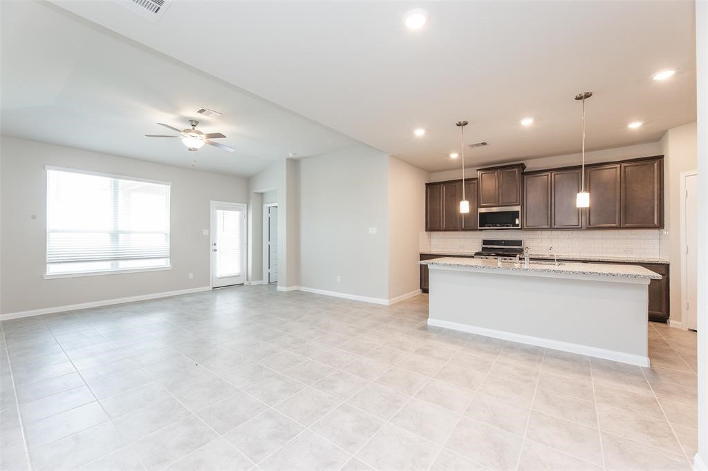1230 Glendora Drive Rosharon, TX 77583 - Photo 7 of 28 a view of large kitchen with a sink and microwave