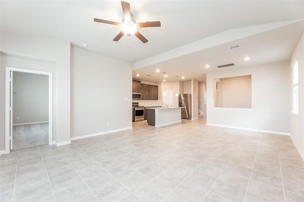 1230 Glendora Drive Rosharon, TX 77583 - Photo 8 of 28 a view of an empty room with a kitchen