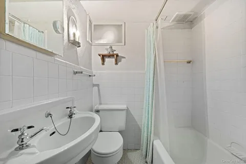 a living room with a couch and a wooden table