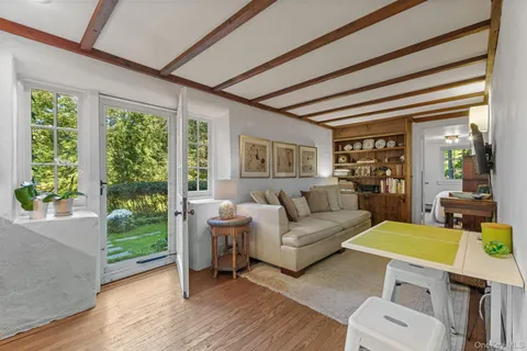 a kitchen with a sink cabinets and wooden floor