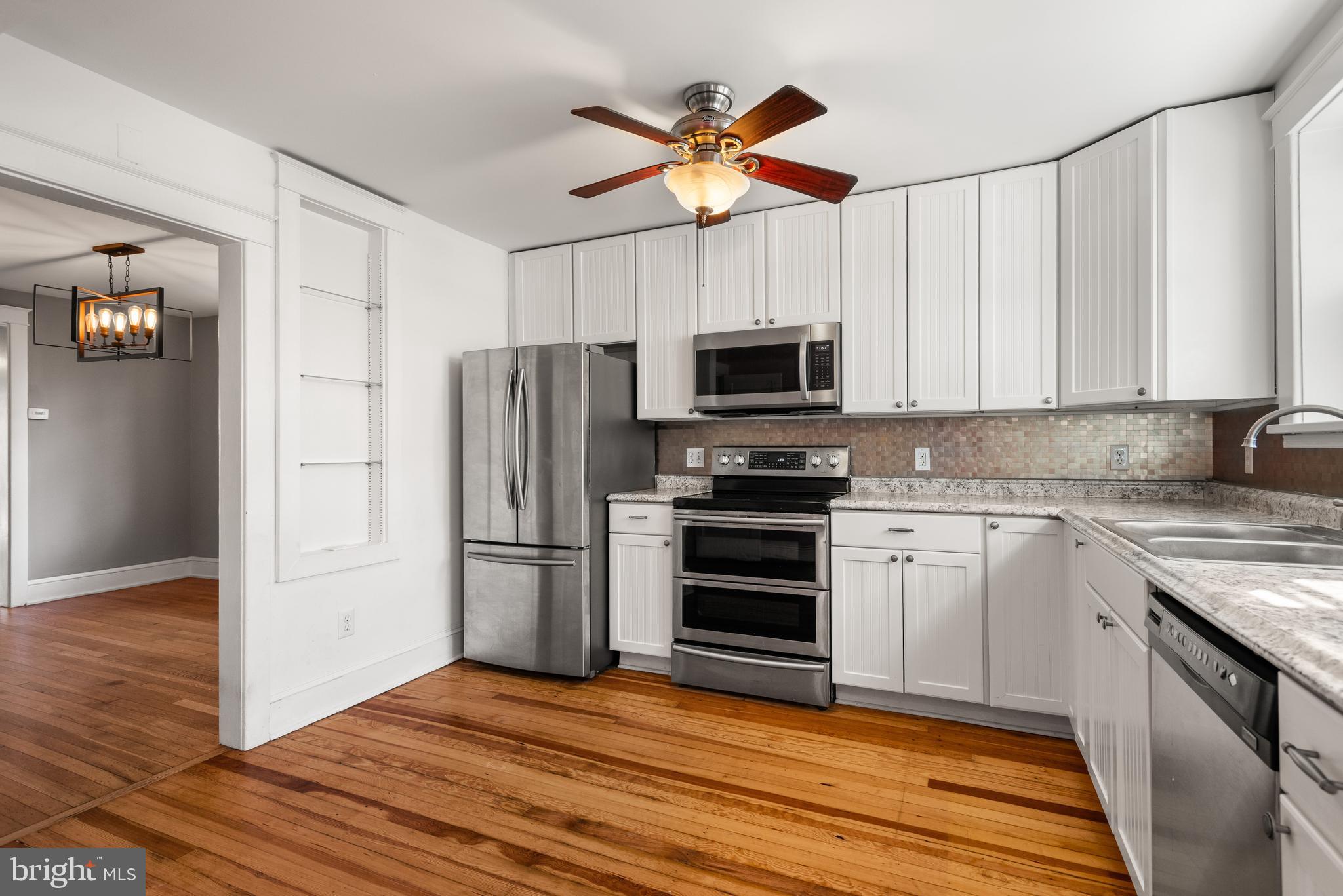 112 Conestoga Road Wayne, PA 19087 - Photo 12 of 32 a kitchen with a refrigerator stove and microwave