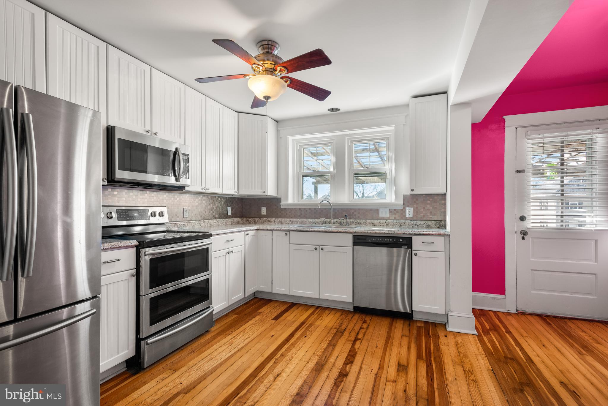 112 Conestoga Road Wayne, PA 19087 - Photo 13 of 32 a kitchen with granite countertop stainless steel appliances and wooden cabinets