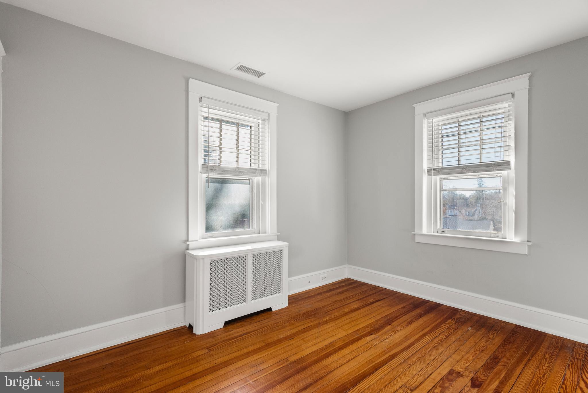 112 Conestoga Road Wayne, PA 19087 - Photo 16 of 32 an empty room with wooden floor and windows