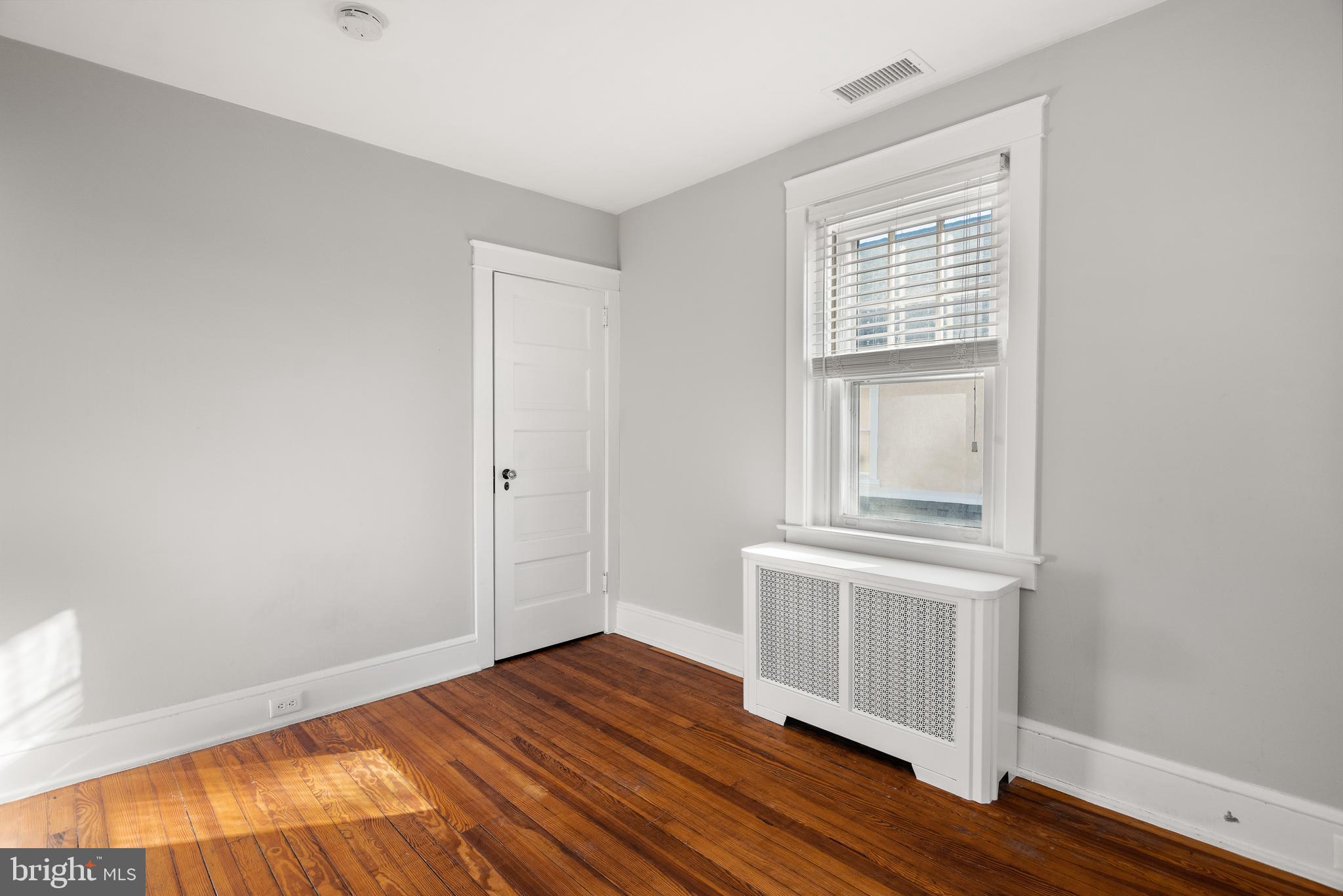 112 Conestoga Road Wayne, PA 19087 - Photo 17 of 32 a view of empty room with wooden floor and fan