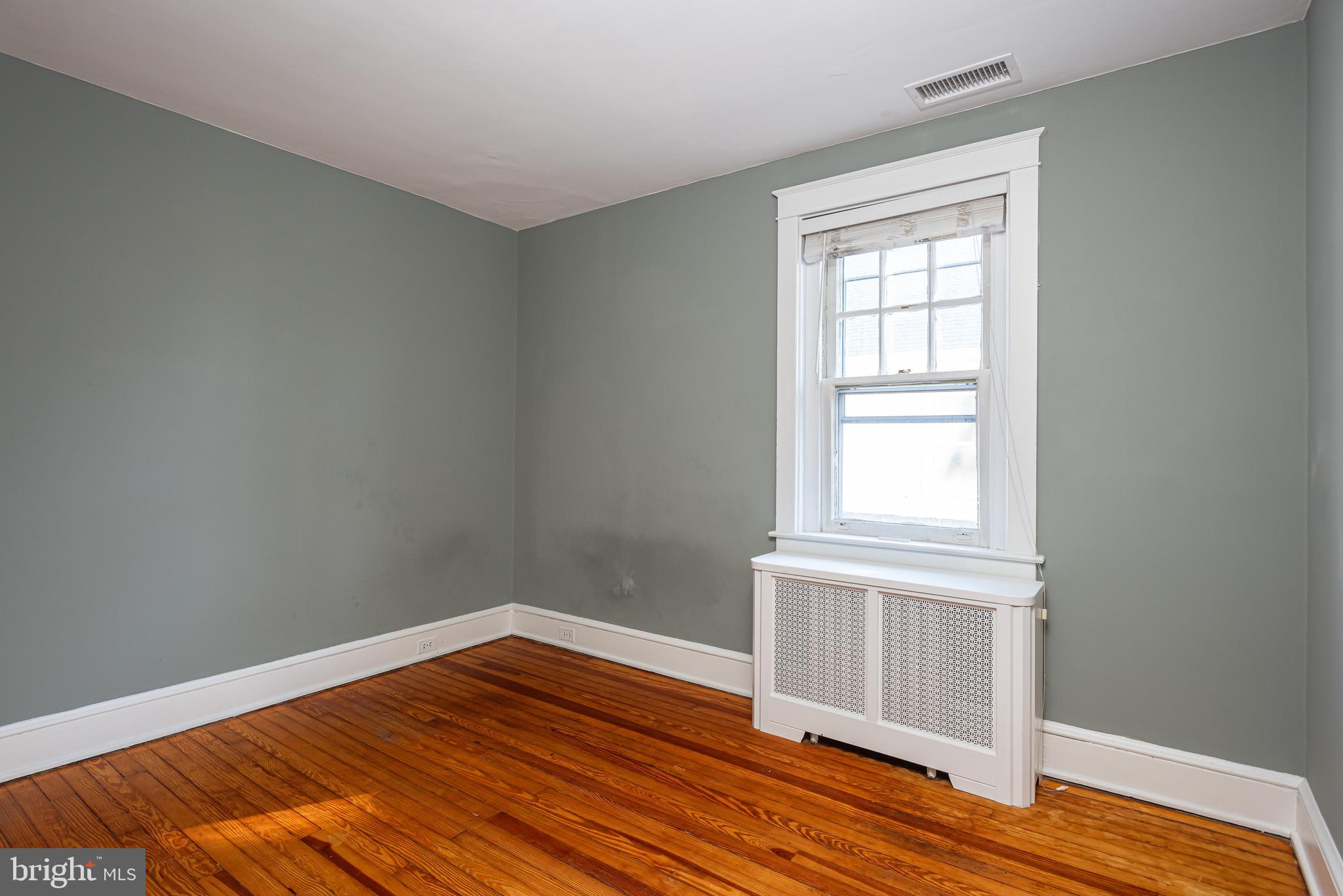 112 Conestoga Road Wayne, PA 19087 - Photo 18 of 32 an empty room with wooden floor and windows
